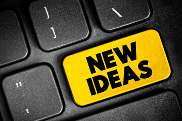 New Ideas text button on keyboard, concept background