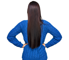 Young hispanic woman wearing casual clothes standing backwards looking away with arms on body