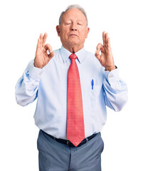 Senior handsome grey-haired man wearing elegant tie and shirt relax and smiling with eyes closed doing meditation gesture with fingers. yoga concept.