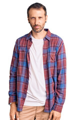 Fototapeta premium Young handsome man wearing casual clothes depressed and worry for distress, crying angry and afraid. sad expression.