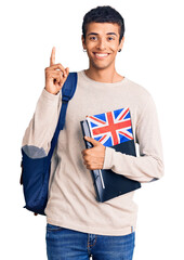 Young african amercian man wearing student backpack holding binder and uk flag surprised with an...