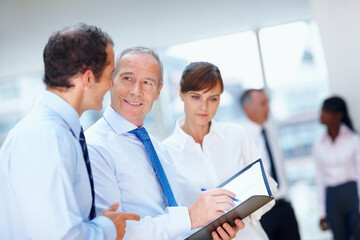 Business people, meeting and group with brainstorming, teamwork and planning with documents, speaking and support. Staff, manager and employees with paperwork, collaboration or cooperation with ideas