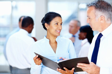 Business people, manager and folder for teamwork, planning or advice in human resources and office meeting. Professional woman, clients or mature boss with documents, report and employee management