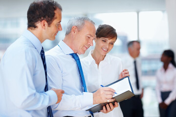 Fototapeta premium Business people, meeting and group with collaboration, brainstorming and planning with documents, speaking and project. Staff, manager or employees with paperwork, teamwork and partnership with ideas