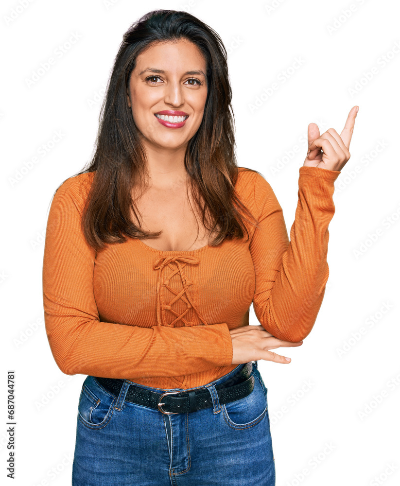 Canvas Prints Beautiful hispanic woman wearing casual clothes smiling happy pointing with hand and finger to the side