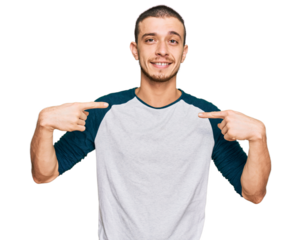 Hispanic young man wearing casual clothes looking confident with smile on face, pointing oneself with fingers proud and happy.
