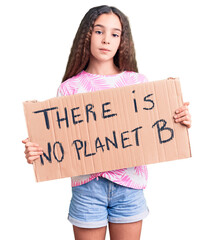 Cute hispanic child girl holding there is no planet b banner thinking attitude and sober expression...