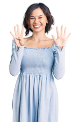 Young beautiful girl wearing casual clothes showing and pointing up with fingers number nine while smiling confident and happy.