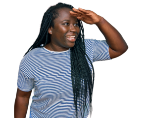 Young black woman with braids wearing casual clothes very happy and smiling looking far away with hand over head. searching concept.