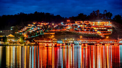 Color night light Ban Rak Thai village Beside Beautiful lake, Chinese settlement is travel...