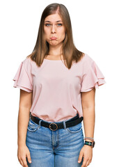 Obraz premium Beautiful caucasian woman wearing casual clothes depressed and worry for distress, crying angry and afraid. sad expression.