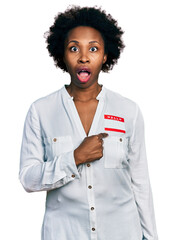 African american woman with afro hair wearing hello my name is sticker identification afraid and...