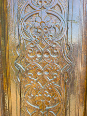 An old wooden door with Arabic carvings