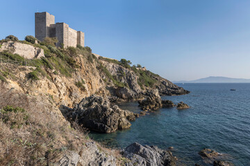Fototapeta na wymiar Aldobrandeschi Castle on Mediterranean shore, Talamone, Italy