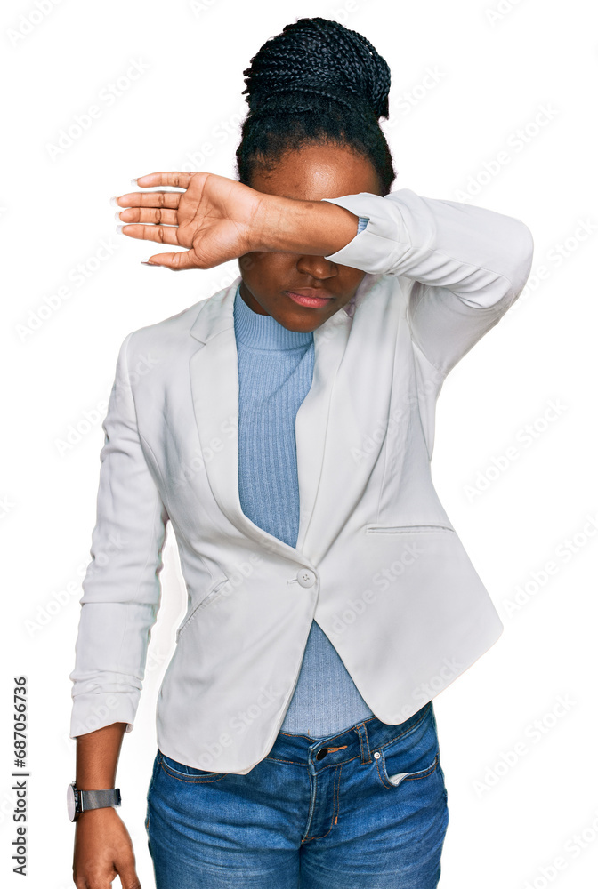 Sticker Young african american woman wearing business clothes covering eyes with arm, looking serious and sad. sightless, hiding and rejection concept