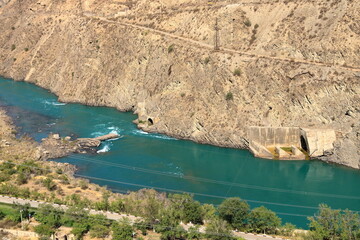 Kurpsai Hydro station. Lower Naryn River Canyon near Toktogul in Kyrgyzstan. Hydroelectric dam in...
