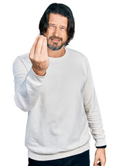 Middle age caucasian man wearing casual clothes doing italian gesture with hand and fingers confident expression