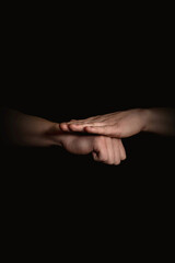 Fototapeta premium human hands with anime gestures on a black background
