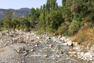 the river at the foot of the waterfall near Arslanbob, Kyrgyzstan, Central Asia