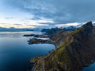 Fototapeta na wymiar aerial view of Gylttinden mountain and road to moskenes port during morning on lofoten islands in norwat with mountains on backgorund