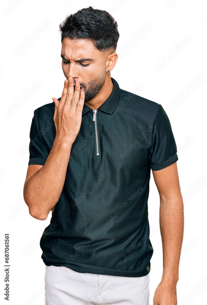 Canvas Prints Young man with beard wearing sportswear bored yawning tired covering mouth with hand. restless and sleepiness.