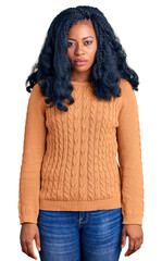 Beautiful african american woman wearing casual  sweater depressed and worry for distress, crying...