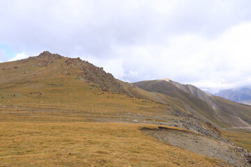 Fototapeta na wymiar Kalmak Ashu pass in Central Tian Shan mountains, way to Song Kol lake, Kyrgyzstan, Central Asia