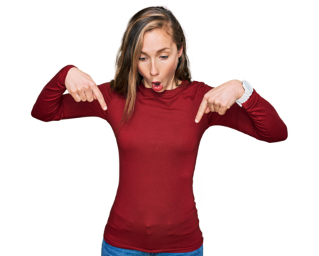 Young blonde woman wearing casual clothes pointing down with fingers showing advertisement, surprised face and open mouth