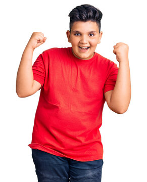 Little boy kid wearing casual clothes screaming proud, celebrating victory and success very excited with raised arms