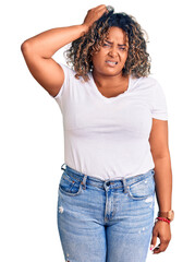 Young african american plus size woman wearing casual clothes confuse and wonder about question....