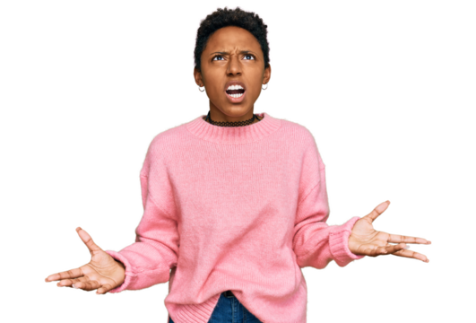 Young african american woman wearing casual clothes crazy and mad shouting and yelling with aggressive expression and arms raised. frustration concept.