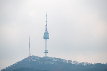 N Seoul Tower in cloudy sky. It is the landmark which is a communication and observation tower...