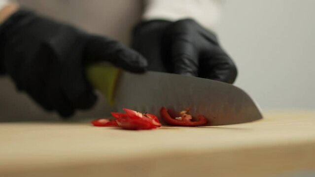 Cook preparing to cook Thai food by cutting chili pepper stock video, Homemade cooking concept