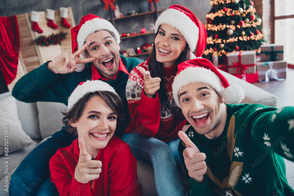 Wall mural photo of funky peaceful buddies make selfie point fingers camera you show v-sign christmas atmospher