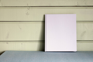 mockup book, an album with an empty cover. Cottage interior. background, copy space.