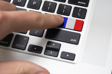 A keyboard with a labeled button - Flag of France
