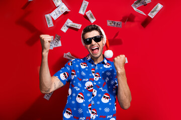 Portrait of crazy guy wear stylish santa claus hat fists up hooray winner xmas income black friday...