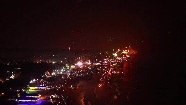 Fireworks on the sea at new year night in Arambol mountain Goa beach India
