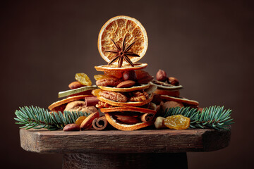 Christmas still-life with dried fruits and nuts. - obrazy, fototapety, plakaty