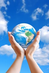 Hands holding planet Earth globe on sky background. Ecological awareness, global peace, and harmonious life without conflict and war. Environmental stewardship and a peaceful coexistence concept.