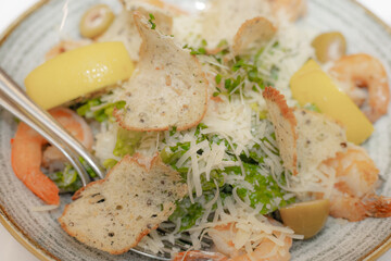 Delicious Vegetarian Plate with Fresh Produce and Kitchen Utensils. Fresh and nutritious vegetarian meal, prepared in a modern kitchen.