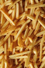 Close-up texture with freshly cooked French fries. Fast food background.