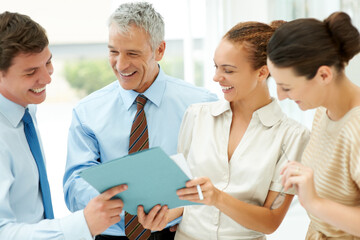 Fototapeta premium Staff, paperwork and collaboration on documents, planning and strategy in office for support. Colleagues, cooperation and brainstorm or analysis, discussion and meeting for report, teamwork on sale