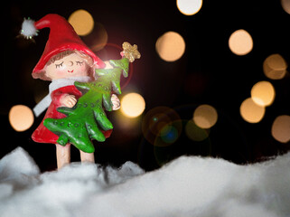 Christmas Background with Copy Text Space and Decorative Girl Holding Tree | Snow and Background Bokeh Lights | New Year Gift Card Template