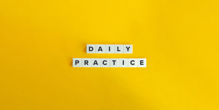 Daily Practice Text on Block Letter Tiles on Yellow Background. Minimalist Aesthetics. Strong Word Ethic, Commitment, and Self-discipline Concept.