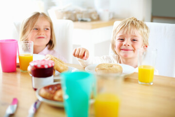 Smile, kitchen and children eating breakfast together for healthy, wellness and diet meal. Happy,...