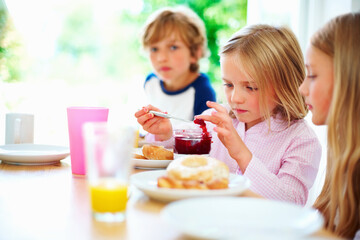 Family, morning and breakfast jam, children and meal for nutrition, orange juice and bagel....