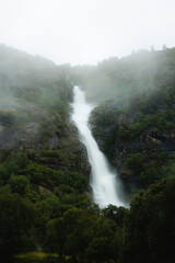 Fototapeta na wymiar Waterfall in the fog in Norway