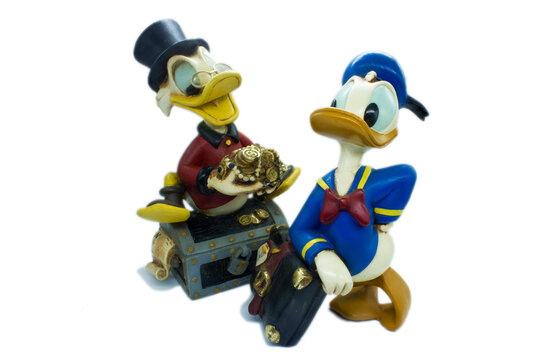 Studio image of Donald Duck and Scrooge McDuck on a white isolated background.
