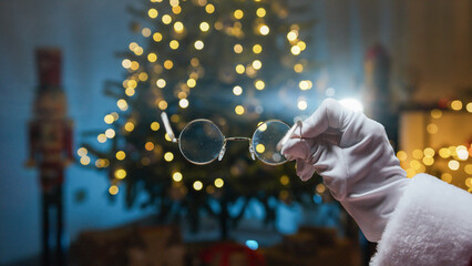 Santa Claus Clean his Eyeglasses to read letters